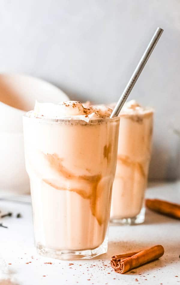 Close up of a glass with salted caramel pumpkin milkshake.