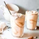 Glasses of pumpkin pie milkshake on a table