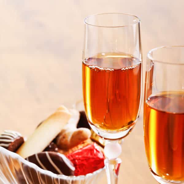 Glasses of sherry wine in champagne glasses.