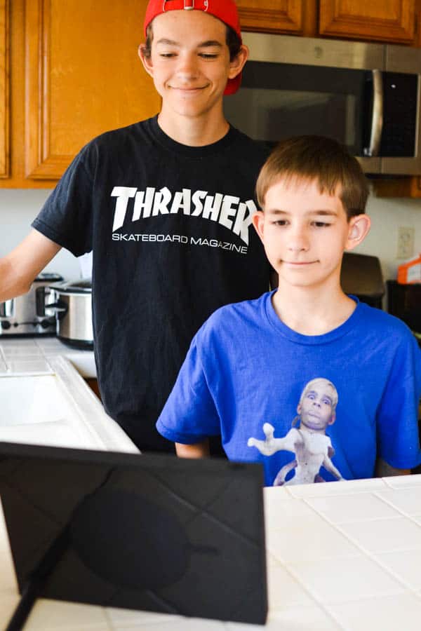 Kids using the Facebook Portal to video chat via messenger.