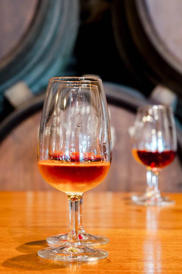 Glasses of sherry wine on a table.