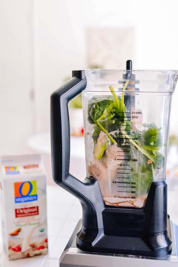 Side view of a blender with ingredients to make an Avocado Banana Smoothie