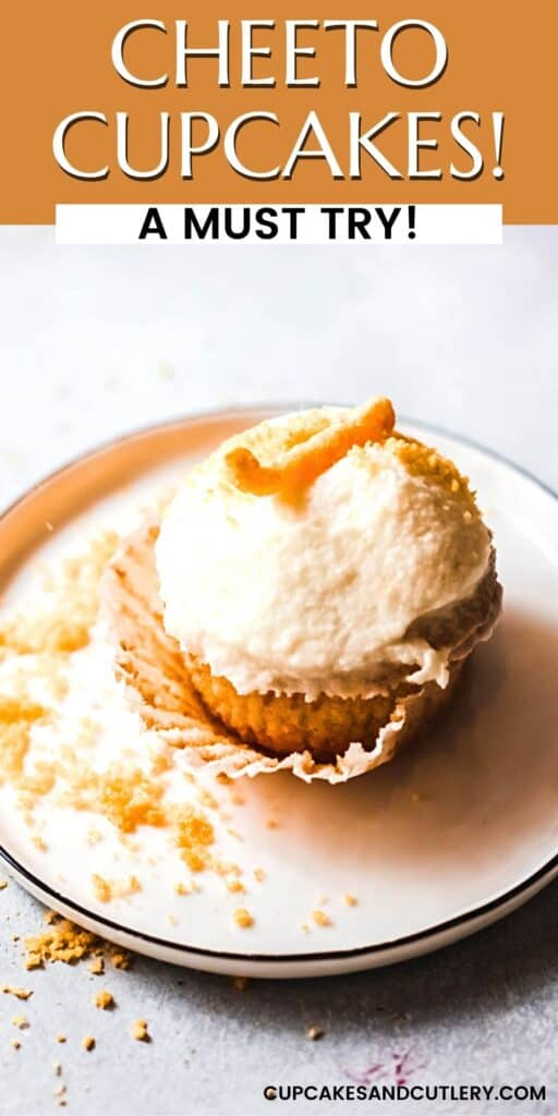Close up of a cupcake made with Cheetos and frosted and topped with a Cheeto.