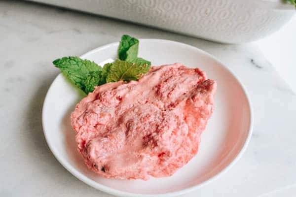 Close up of no bake refrigerator pink dessert on a plate