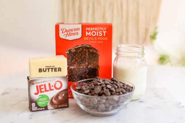 Ingredients for a chocolate dump cake recipe on a cutting board.