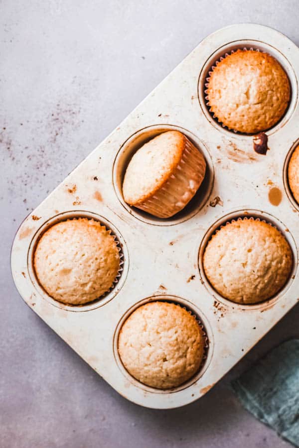 Plain Cheeto cupcakes in a baking pan.