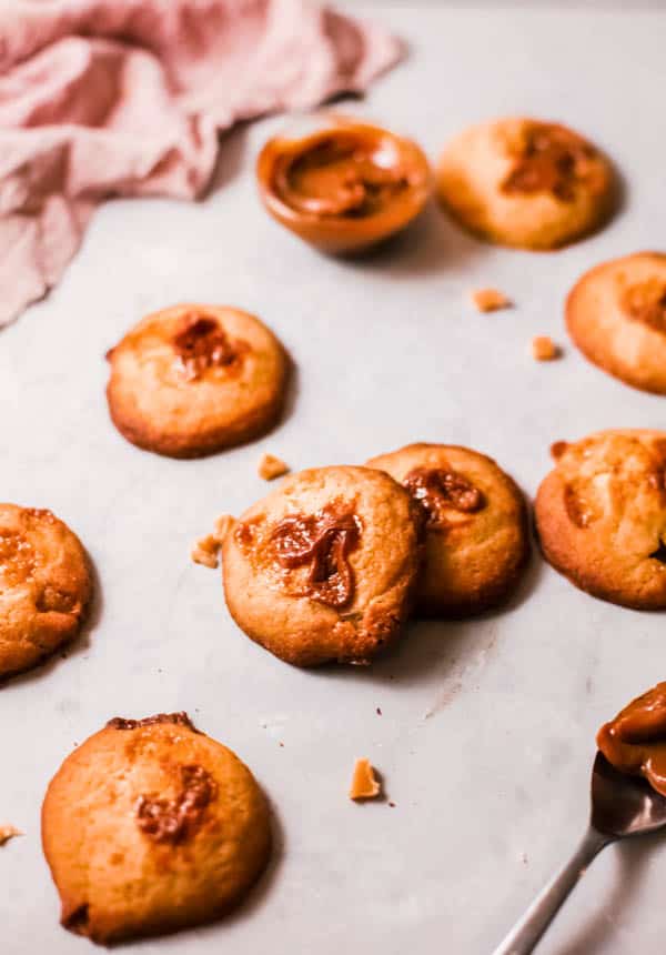 Golden baked cookies with Butterscotch and Walnuts on a table.