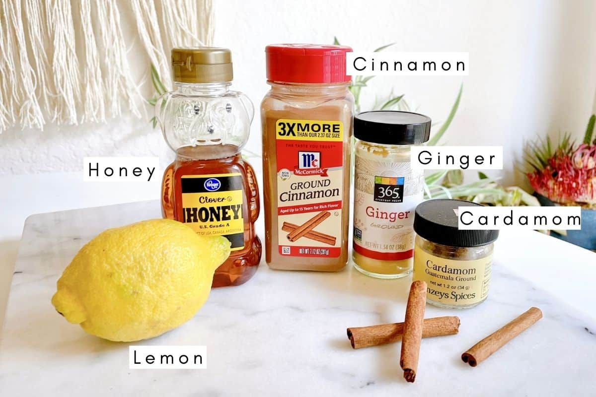 Labeled ingredients to make a honey dip to dip apples in.