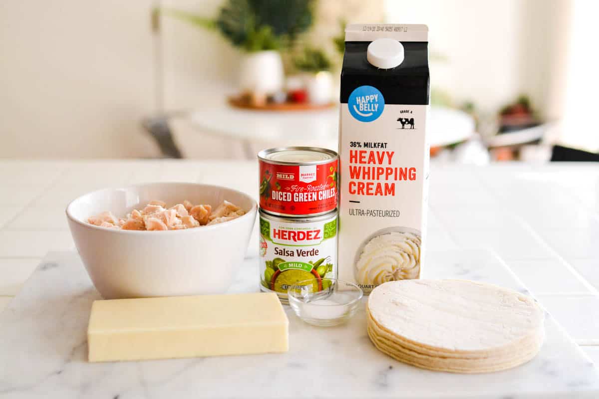 Ingredients for layered green chile chicken enchilada casserole.