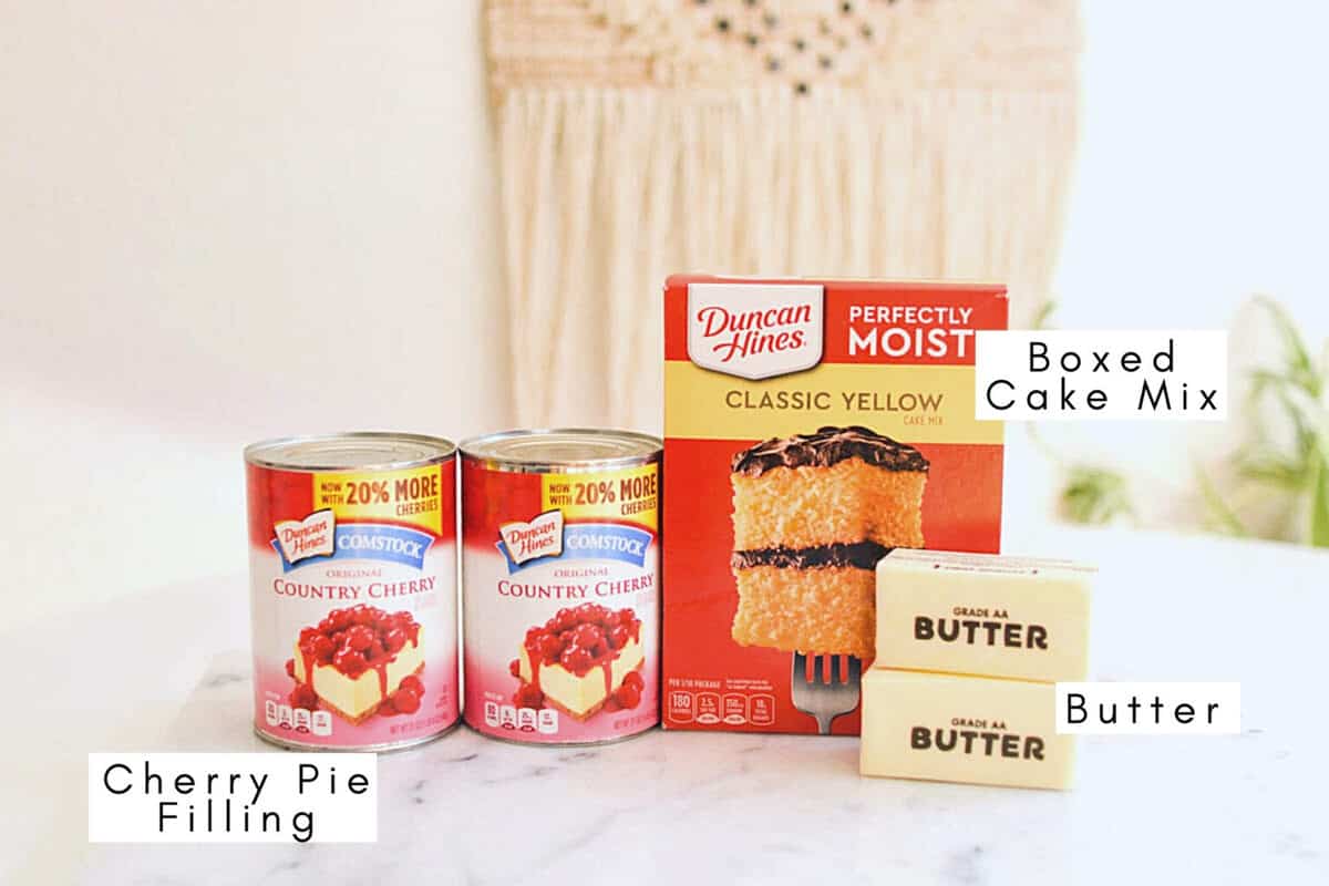 Labeled ingredients to make a crock pot cherry dump cake.