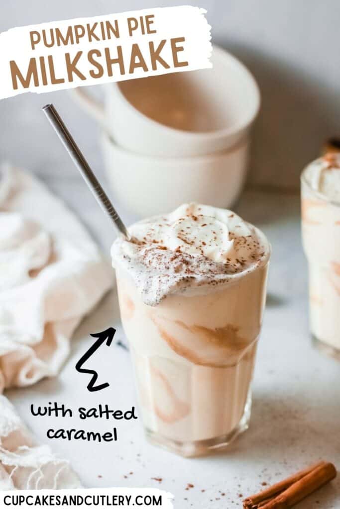 A pumpkin pie milkshake in a glass with a straw sticking out.