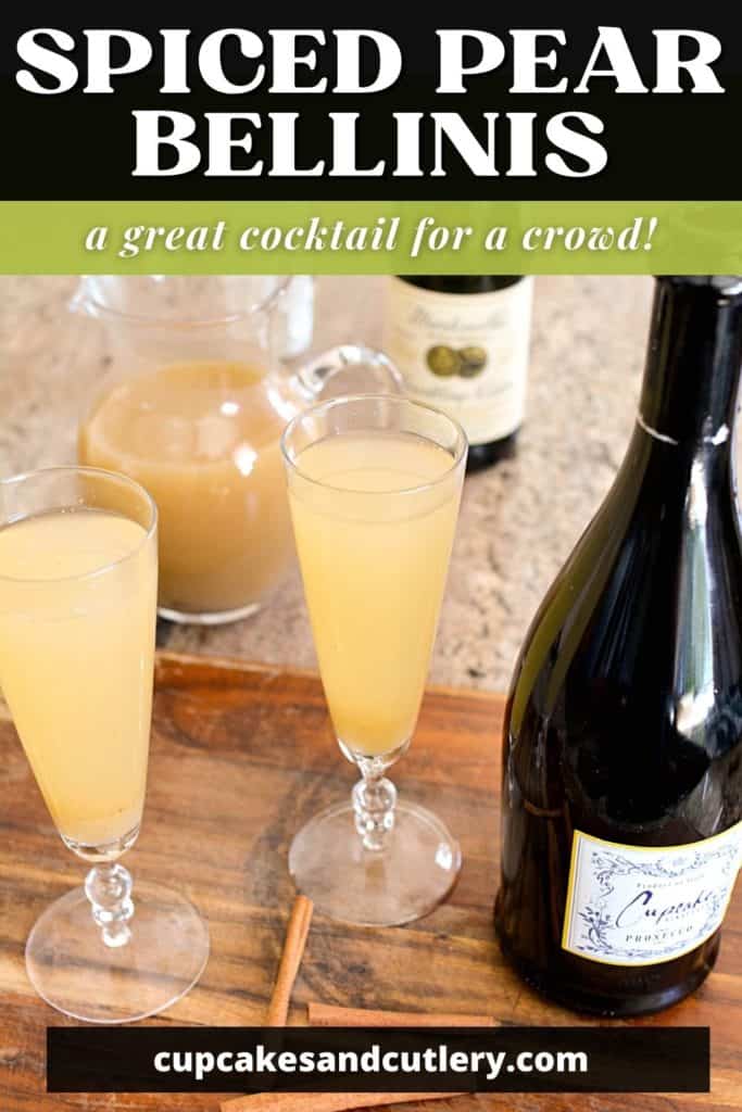 Champagne glasses on a counter with pear bellini in it next to a bottle of champagne.