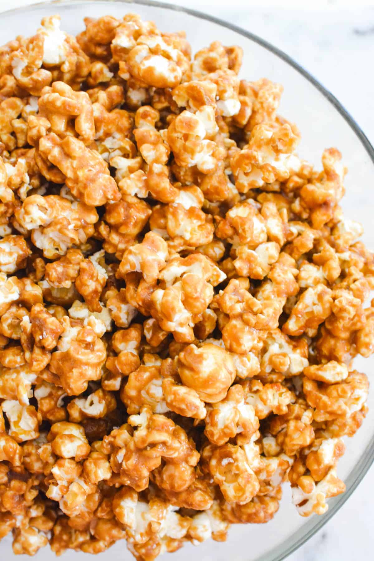 Overhead view of a bowl of caramel corn.