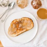 Close up of a plate with a piece of cinnamon toast.