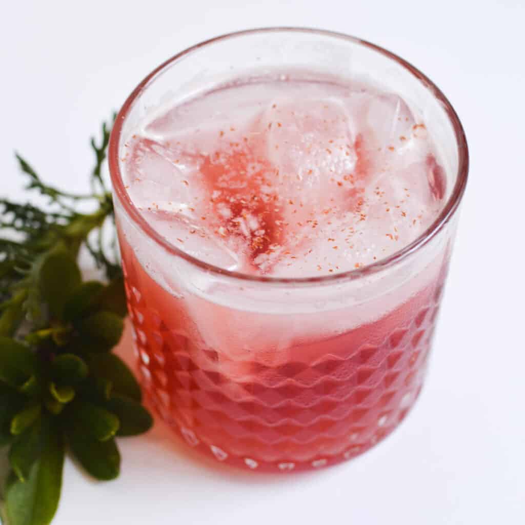 Close up for a bourbon cocktail on a table.