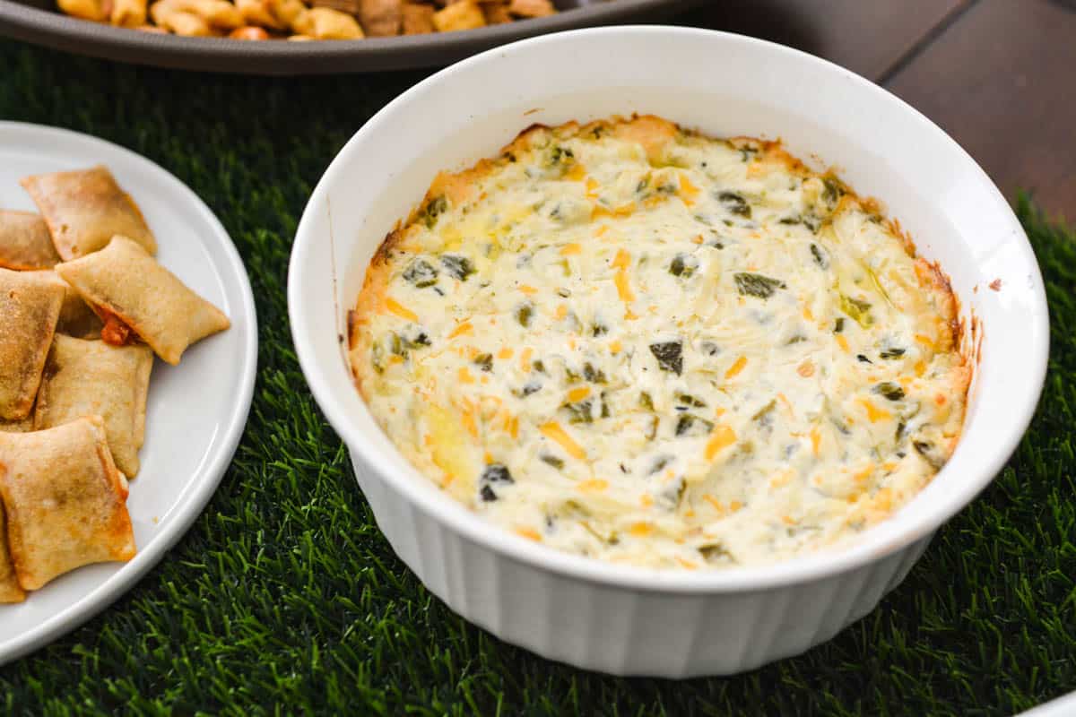 Close up of a hot cream cheese dip in a baking dish.