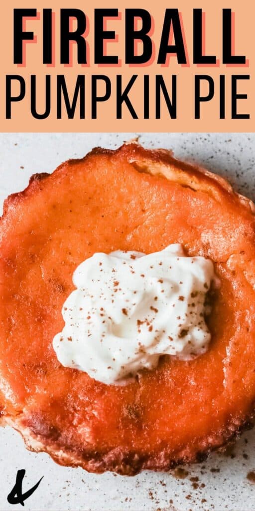 Close up of the top of a pumpkin pie with whipped cream.