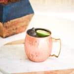 copper mug holding a Mexican Mule on a table