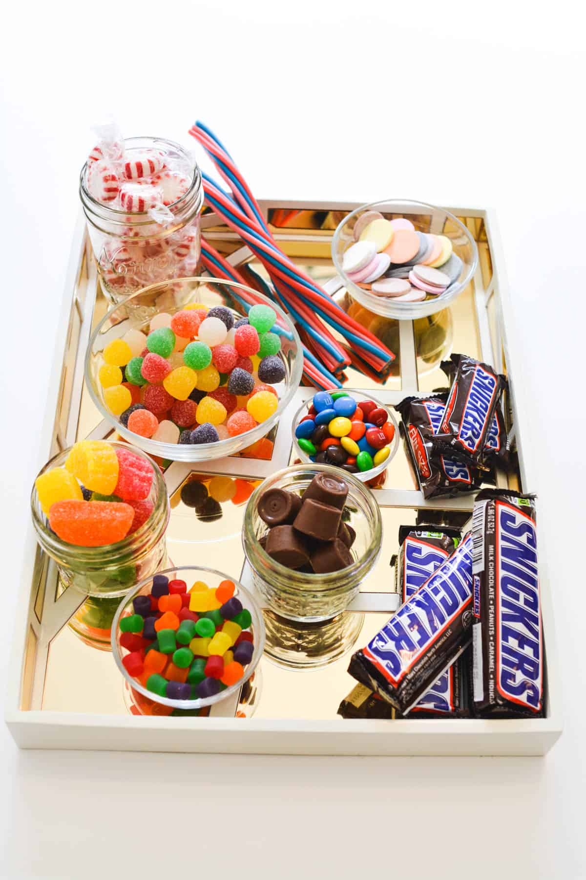 A tray full of candy on a table.