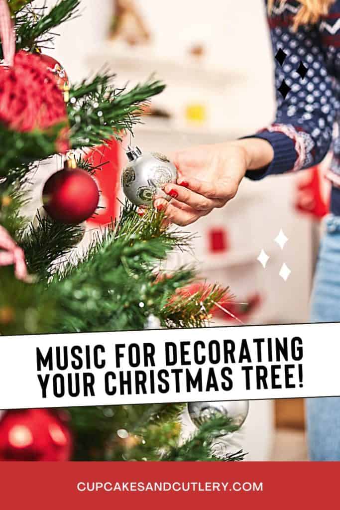 Woman adding a silver ball ornament to a decorated Christmas tree with text over it.