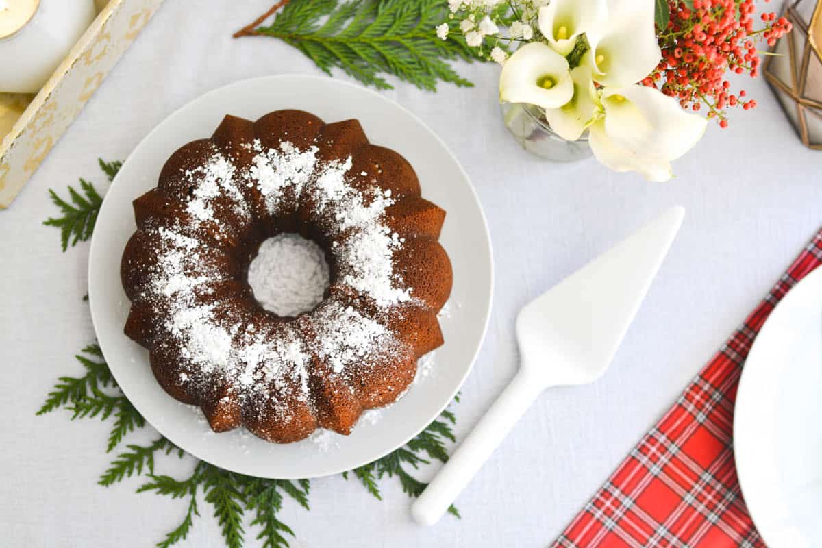 Top of a bundt cake with powdered sugar on it.