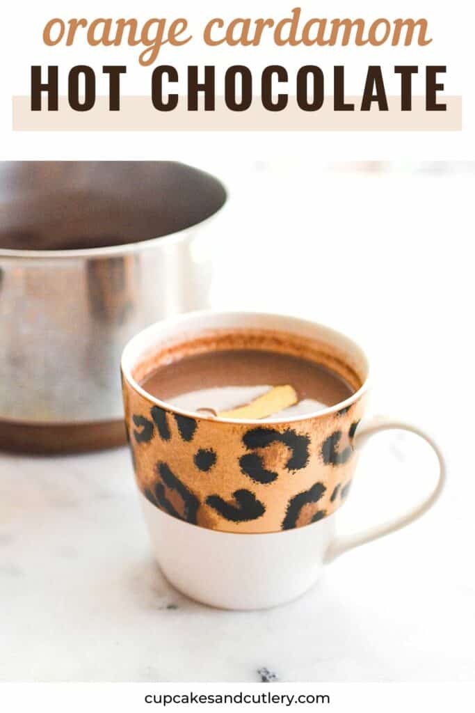 Mug of hot chocolate with the saucepan in the background.