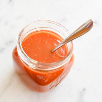 Close up of a jar holding tomato juice