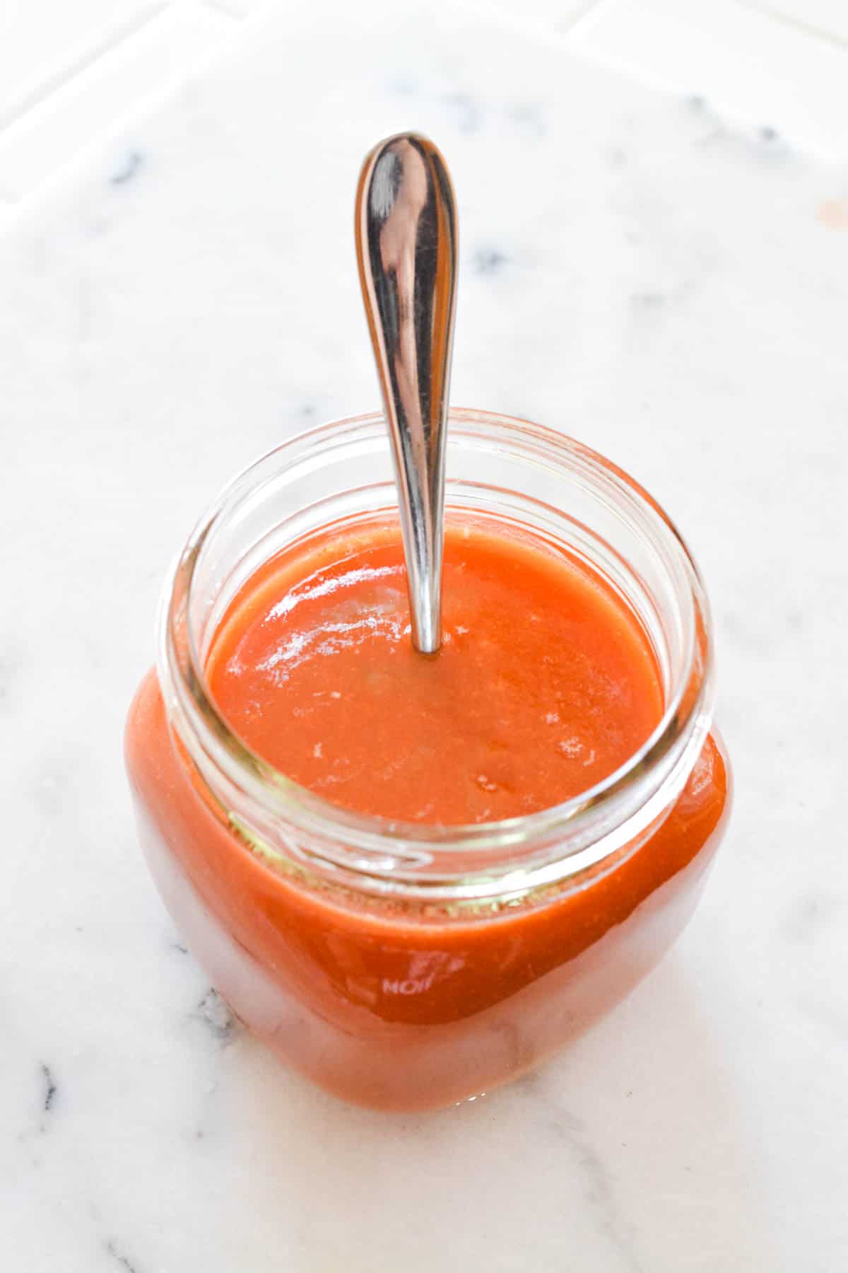 Overhead view of a jar holding a copycat Snap E Tom recipe.