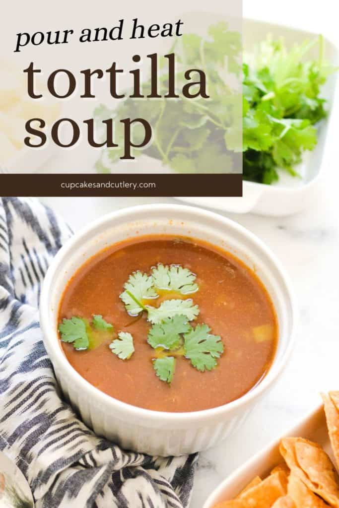 A bowl of Tortilla Soup on a table next to a bowl of cilantro and chips with text - Pour and Stir Tortilla Soup.