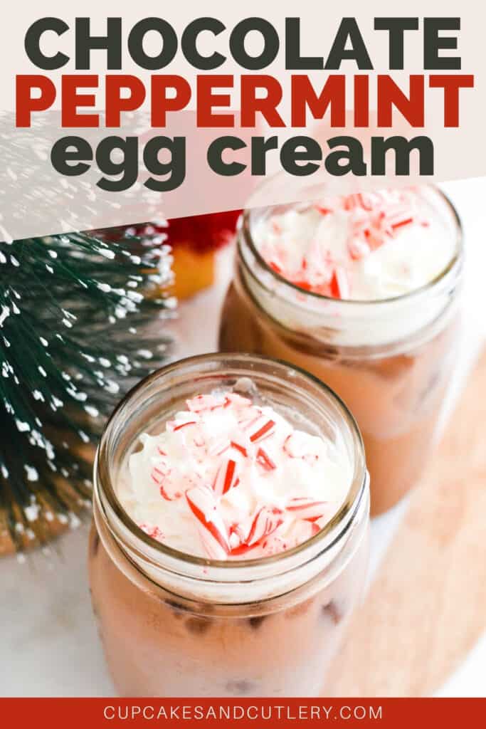 Close up of 2 jars full of a chocolate drink topped with whipped cream and candy cane pieces.