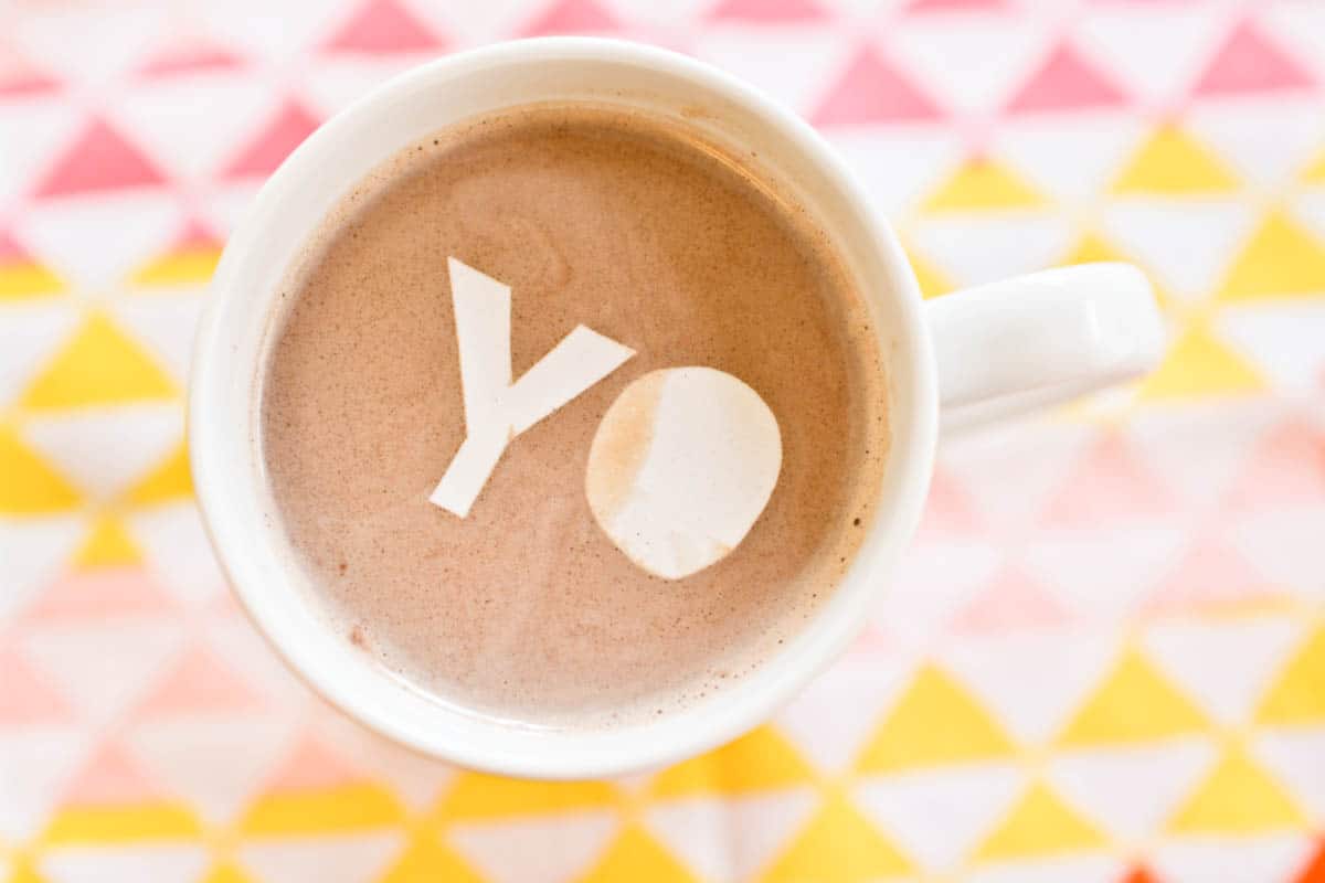 The word "yo" made out of edible confetti in some hot cocoa.