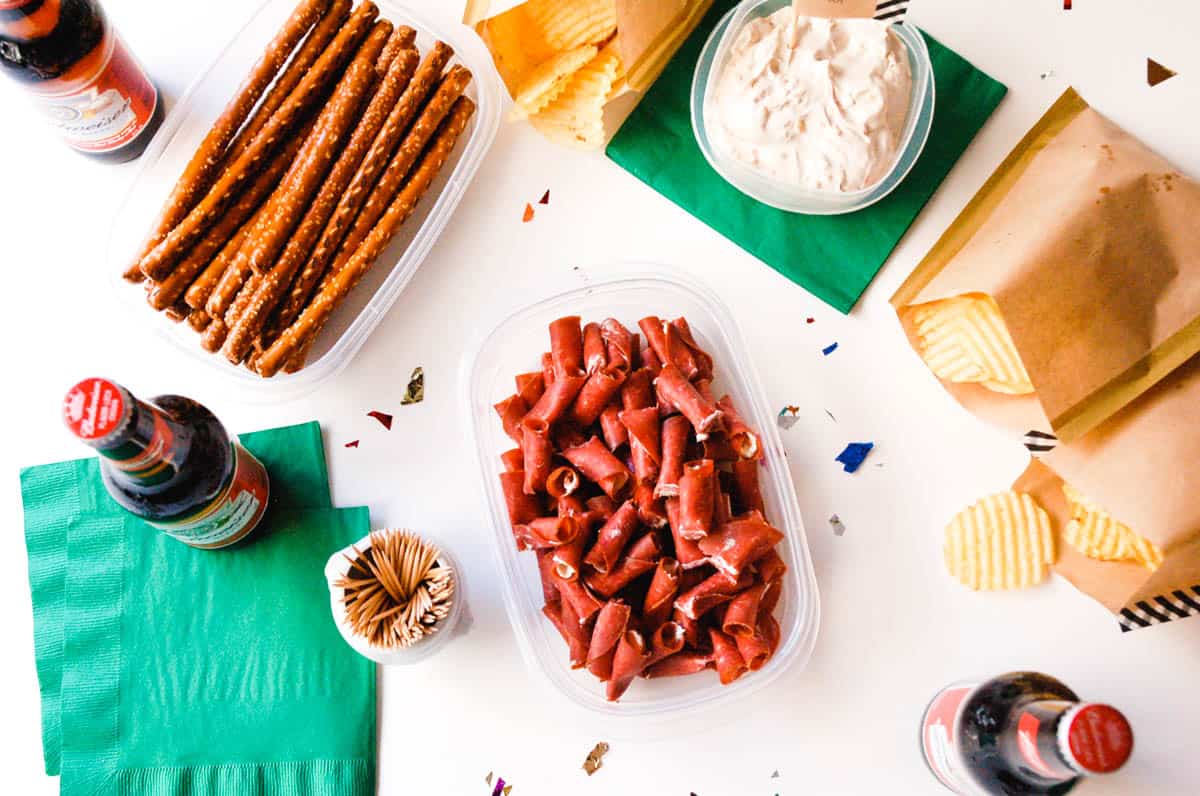 A football party table with snacks.