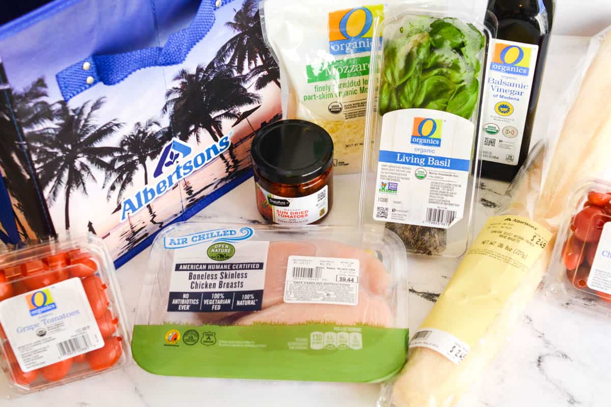 An Albertsons grocery bag next to some items to make dinner with.