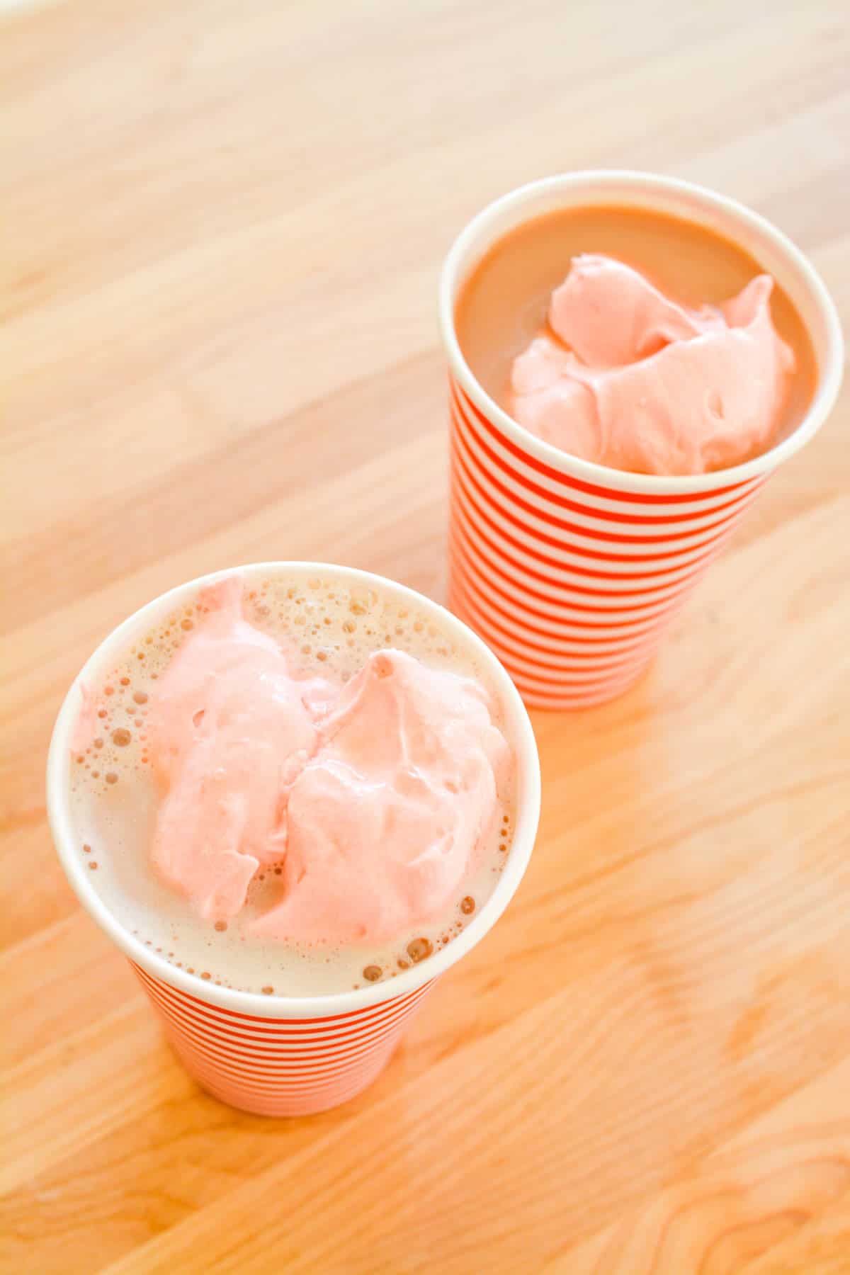Cups of hot chocolate topped with Cherry Fun Dip.