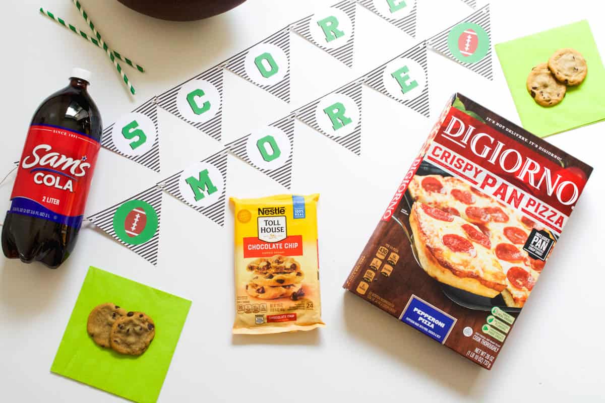 Top down view of a printable football banner and snacks for game day.