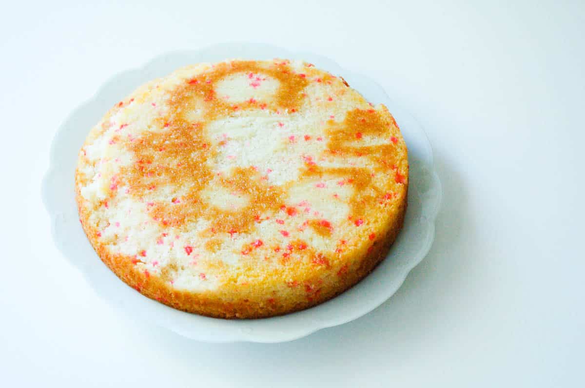 A cherry chip cake on a white plate.