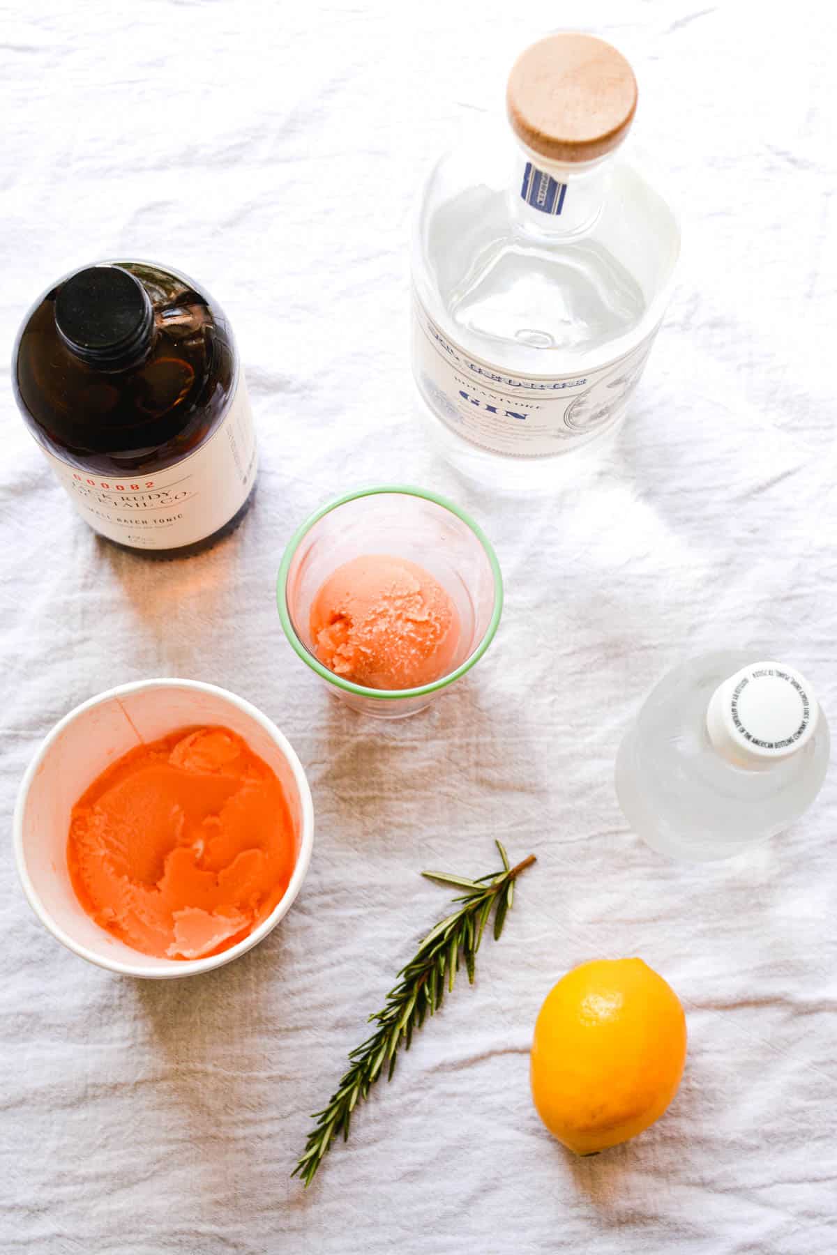 Ingredients to make a boozy float with blood orange sorbet