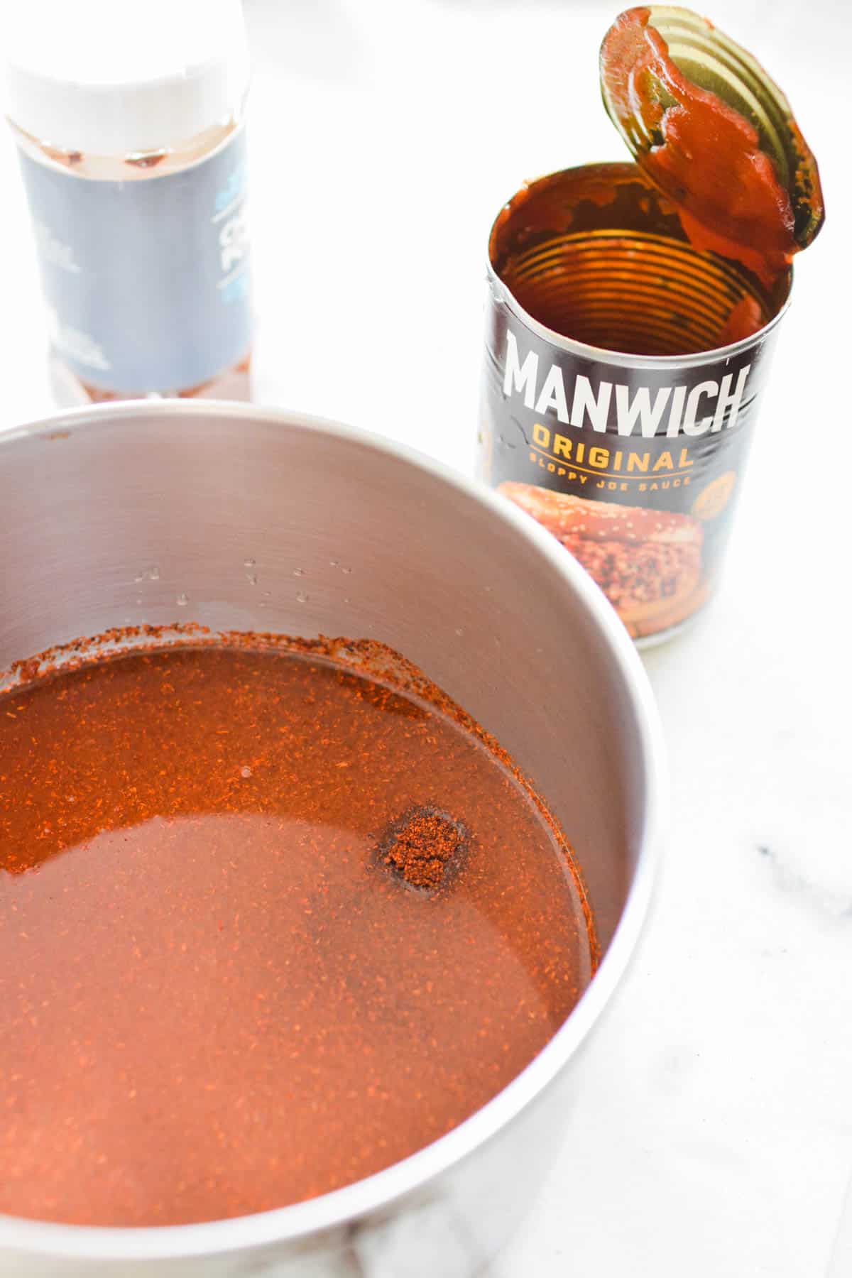 Saucepan with Manwich and spices.