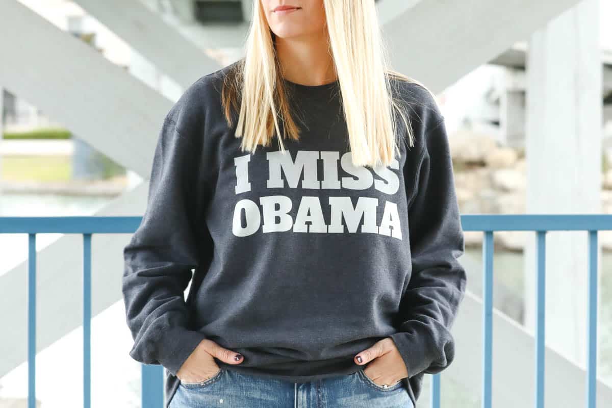 woman wearing and I miss obama sweatshirt