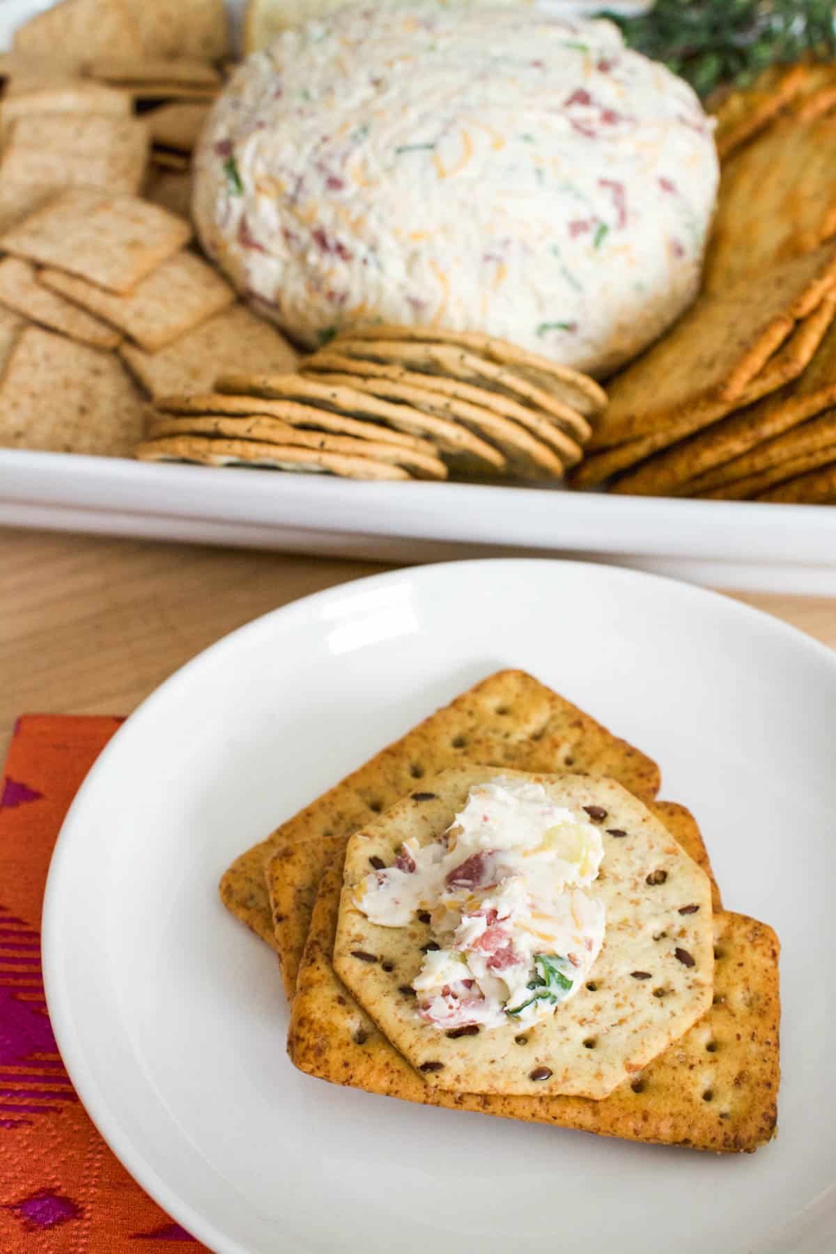 Appetizer plate with crackers and a serving of a cheese ball