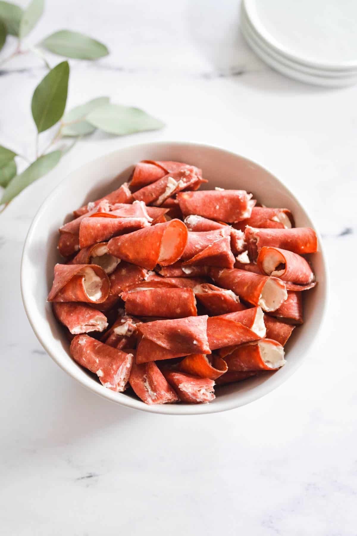 bowl of appetizers made from dried beef and cream cheese