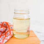 Close up of a jar holding simple syrup.