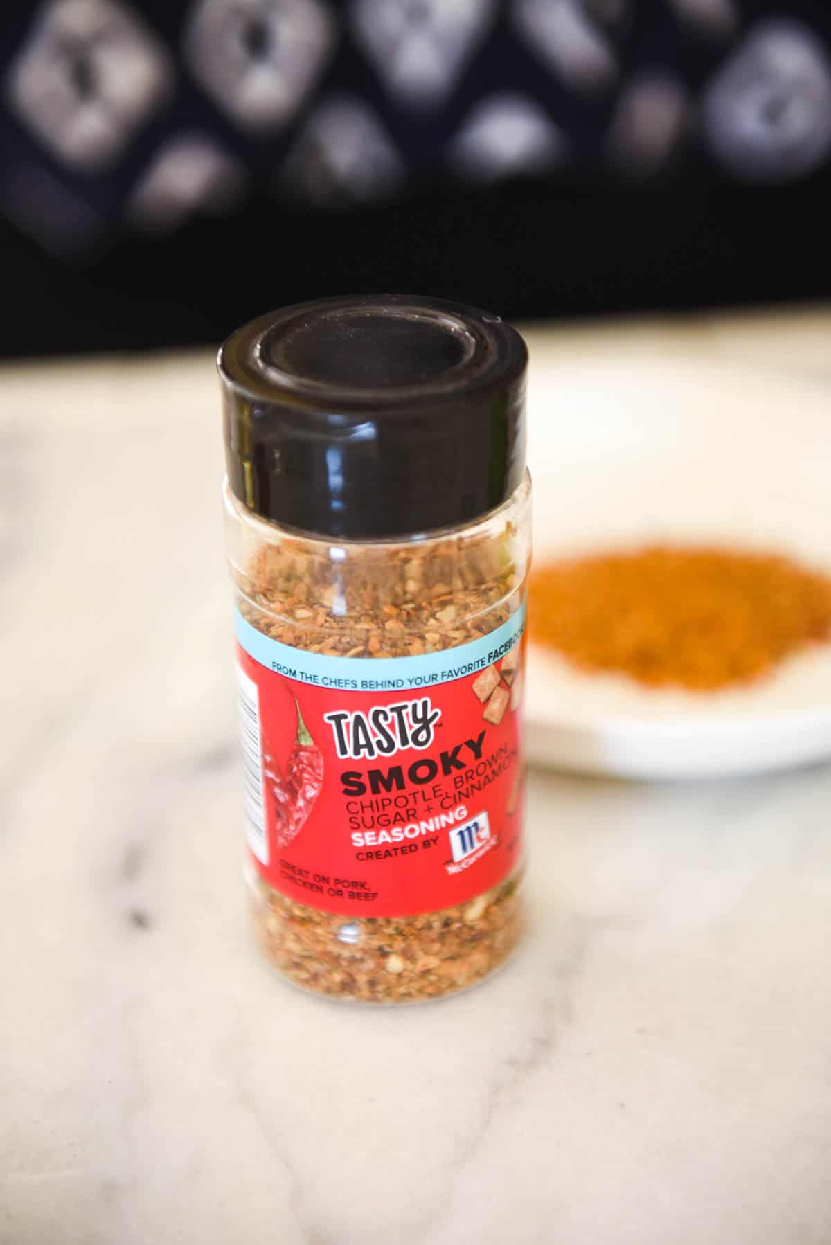 Close up of a smoked sugar blend in a bottle on a counter. 