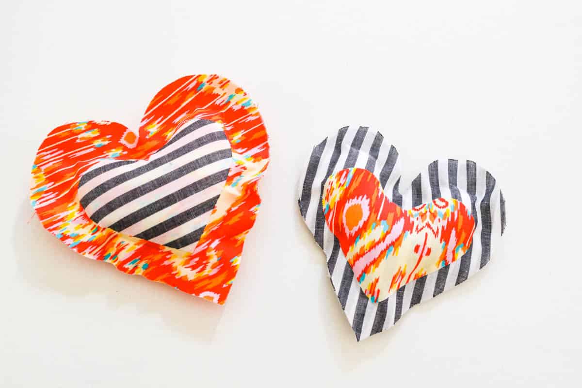 2 mini no-sew heart pillow made out of a variety of fabrics.