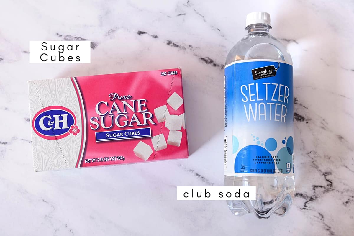 Labeled ingredients to make a sugar cube simple syrup.