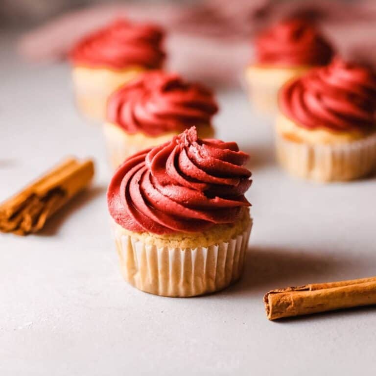 Close up of a cupcakes infused with Fireball Whiskey and topped with red buttercream.