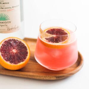 Close up of a cocktail glass with a margarita made with blood orange juice.