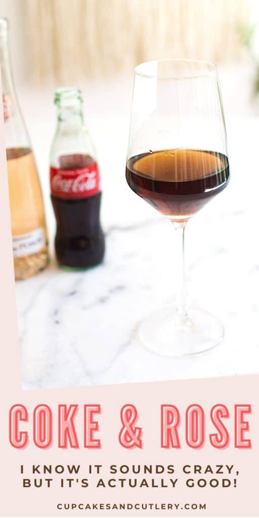 A wine glass with coke and rosé on a table.