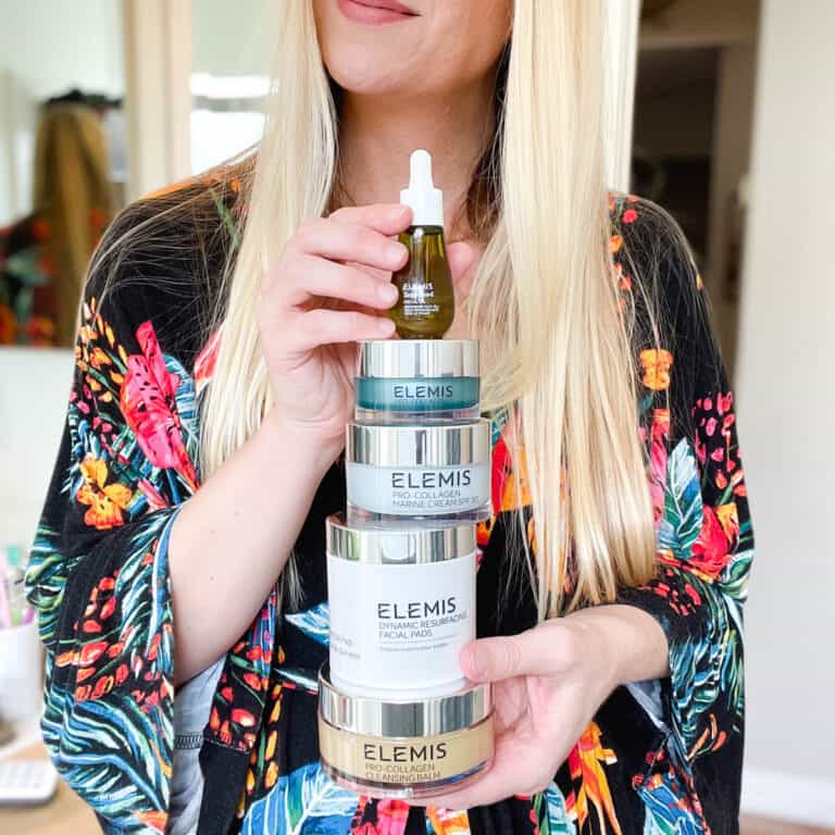 Close up of a girl holding Elemis skincare.