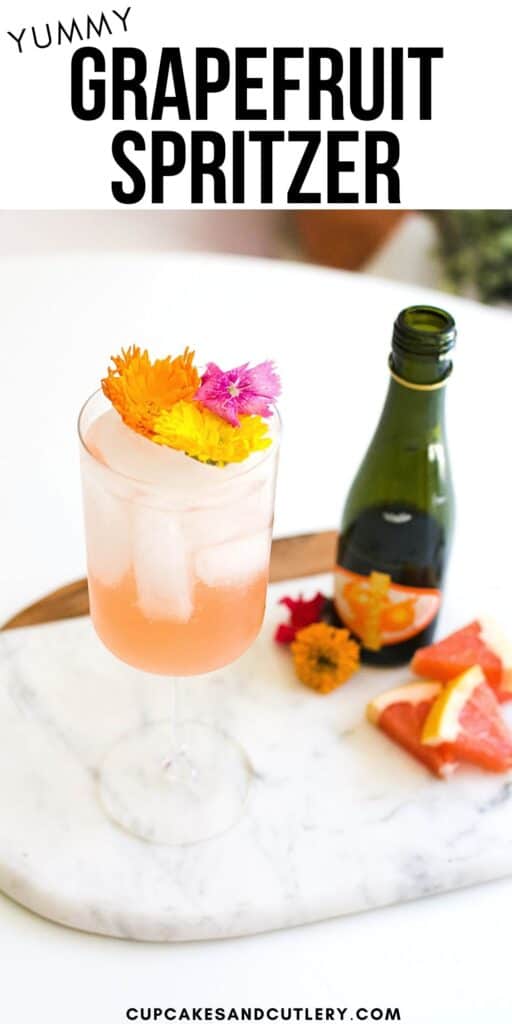 A stemmed wine glass with flower garnish with text around it.